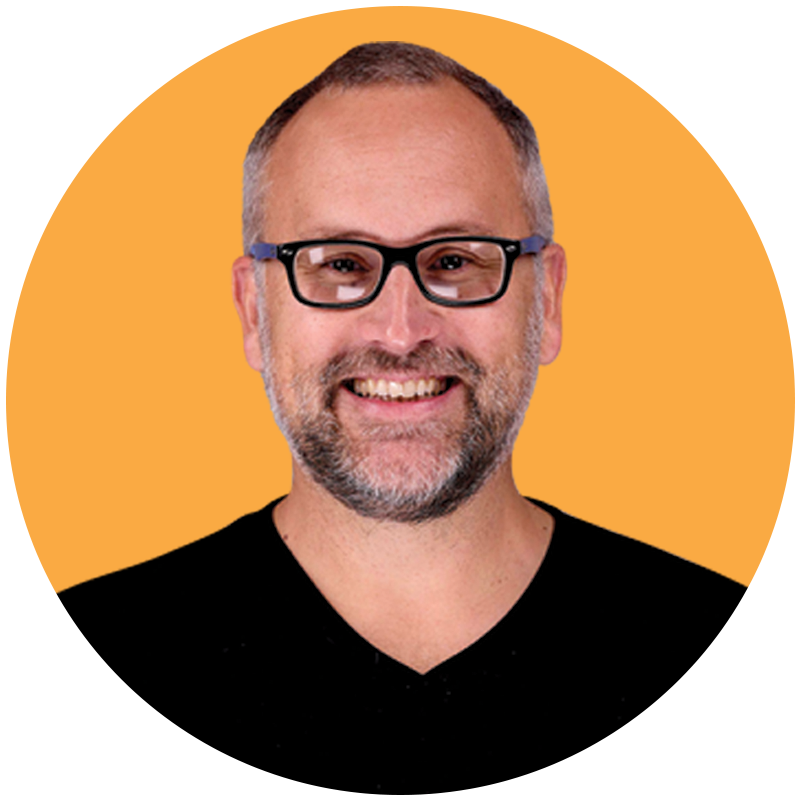 andy headshot orange circle